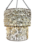 A two-tier drum chandelier featuring a scalloped shell clay disc overlay on a dark metal frame, suspended by black chains against a plain white background.