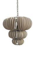 A modern multi-tiered pendant light with a clay disc design.