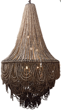 A large conical chandelier made of layered strands of clay beads, with warm lights glowing inside and fringe hanging at the bottom
