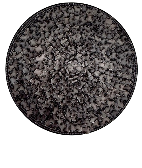 A circular wall art featuring a textured, clay petal floral pattern 