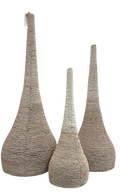 Three tall woven decorative beaded sculptures with tapered, teardrop-shaped 