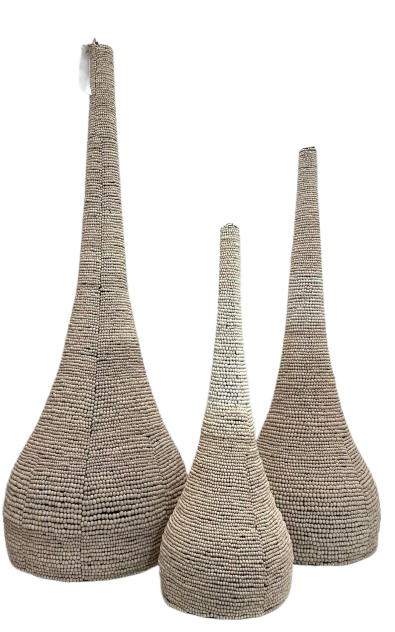 Three tall woven decorative beaded sculptures with tapered, teardrop-shaped 