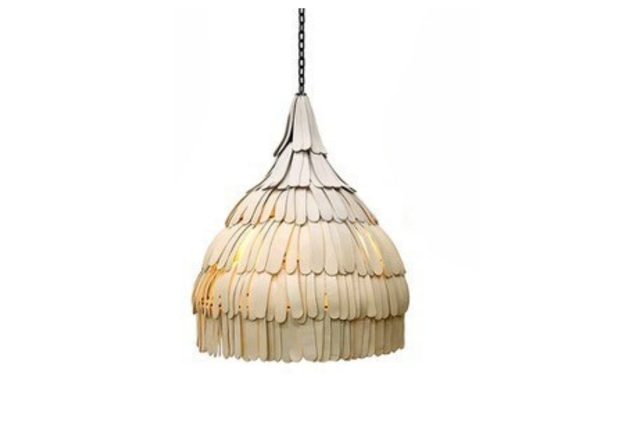 A d pendant light fixture made of overlapping clay pieces.